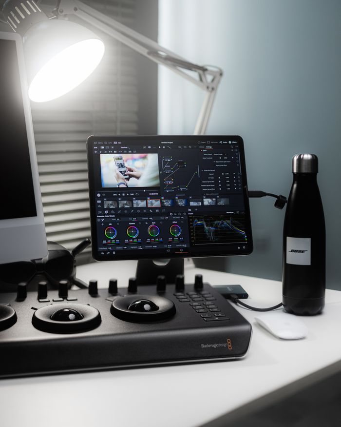 about-05 A sleek workspace featuring video editing tools and devices in a professional setting.